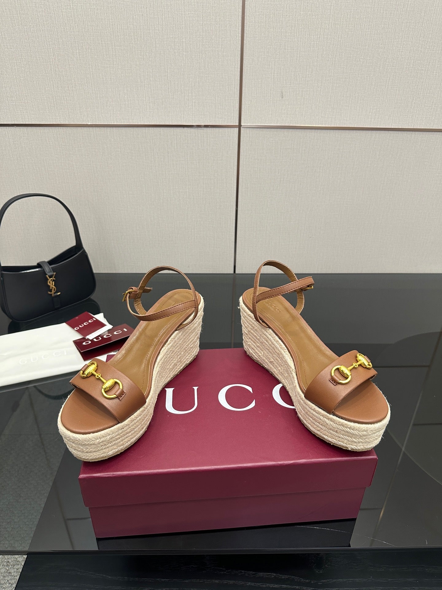 Tan leather espadrille platform wedge sandals with gold buckle on upper