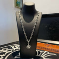 Silver-tone cross-link chain necklace with square pendant and dangling charm