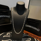 Metal chain necklace on bust display