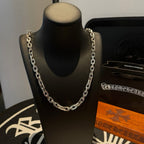 Silver-tone chain necklace with thick links on black display bust.