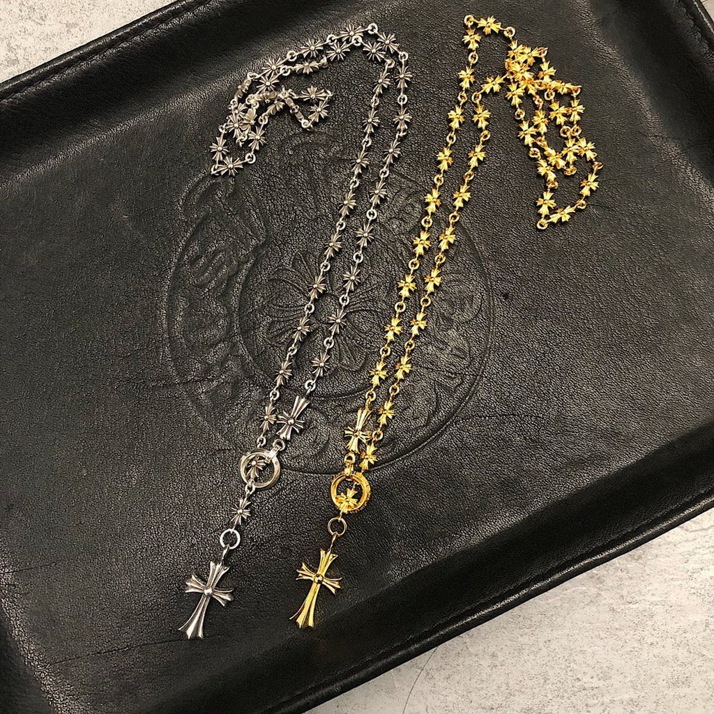 Silver and gold chain necklaces with star and cross pendants