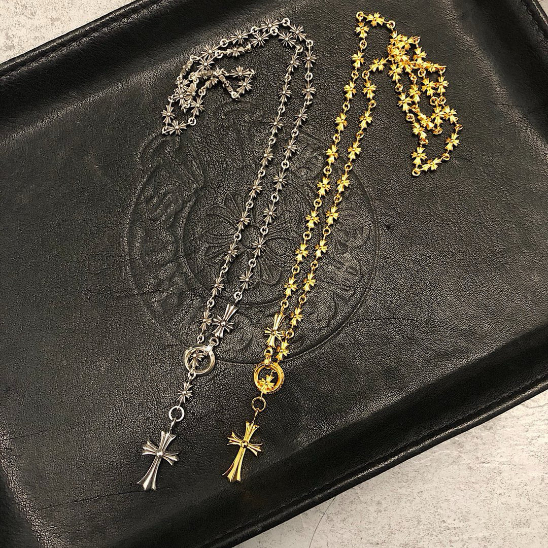 Silver and gold chain necklaces with star and cross pendants