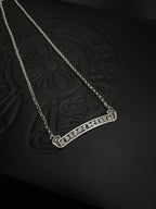 Silver-tone bar pendant necklace with chain and patterned pendant frame