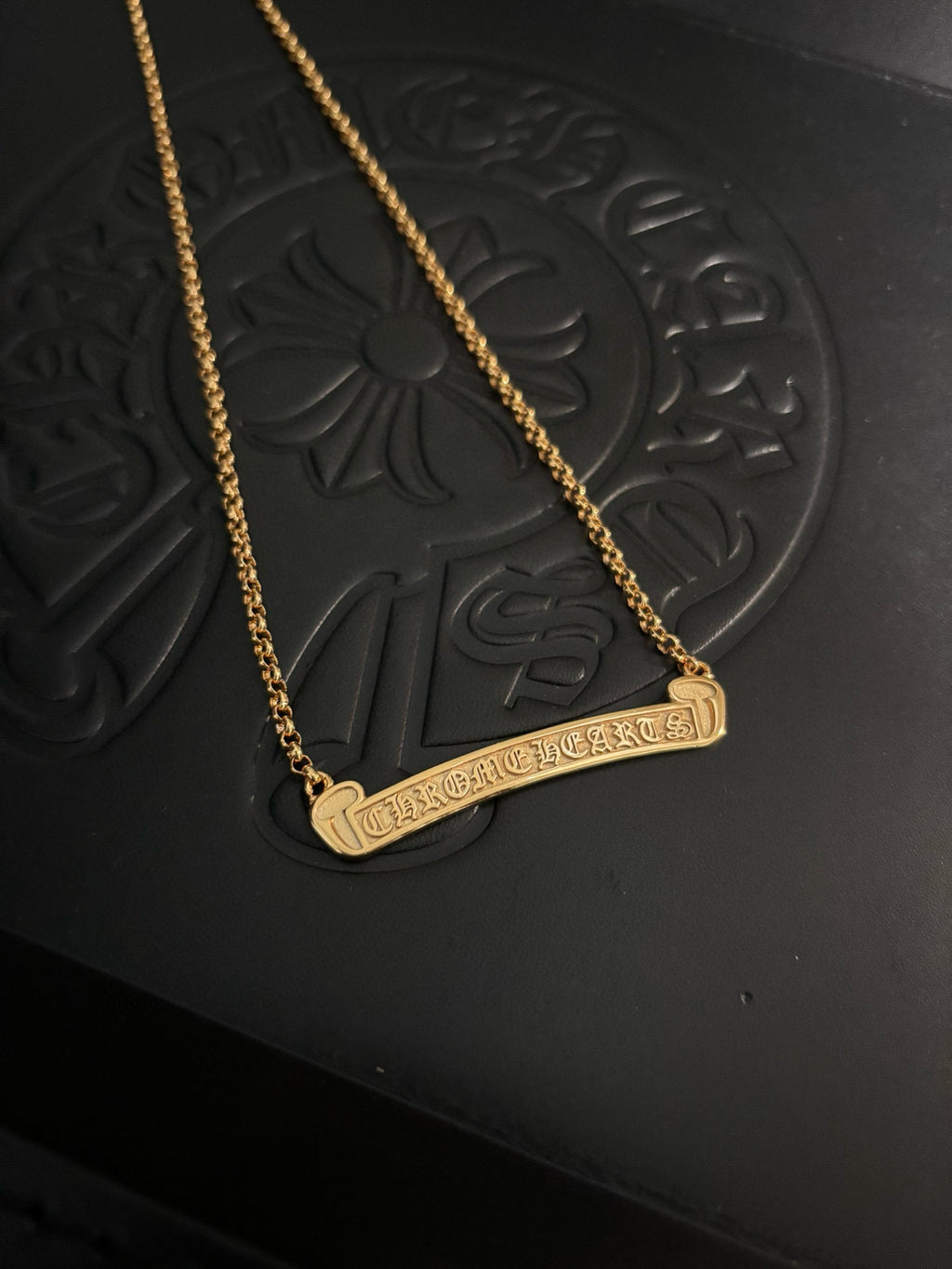 Gold-tone bar pendant necklace with chain and engraved-style bar pendant