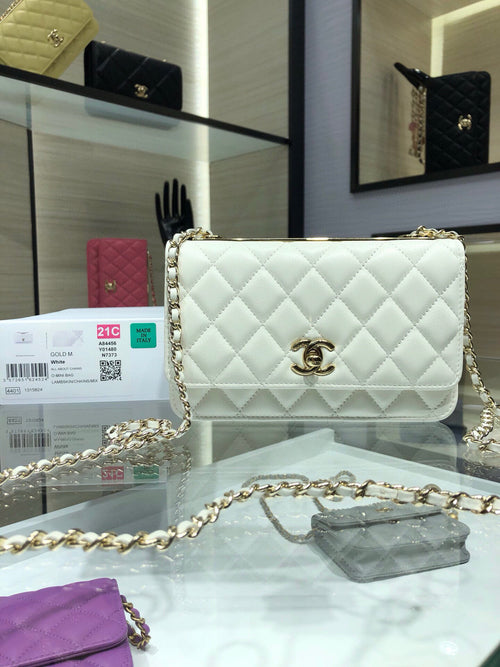 White quilted flap bag with gold chain strap and round logo turn-lock clasp