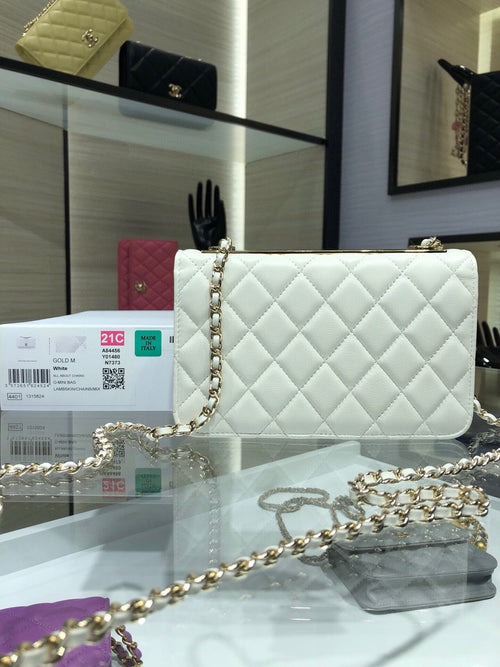 White quilted shoulder bag with gold chain strap and flap front logo turn-lock