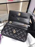 Black quilted Chanel shoulder bag with gold hardware and chain strap