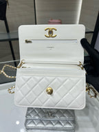 White quilted leather crossbody bag with gold Chanel logo, front panel and chain strap.