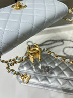 Chanel metallic silver quilted flap bag with gold chain and turn-lock clasp