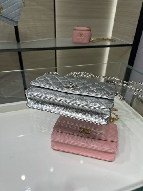 Silver and pink Chanel flap bags with chain straps and quilted texture