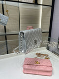 Silver Chanel quilted flap bag with chain strap and logo clasp