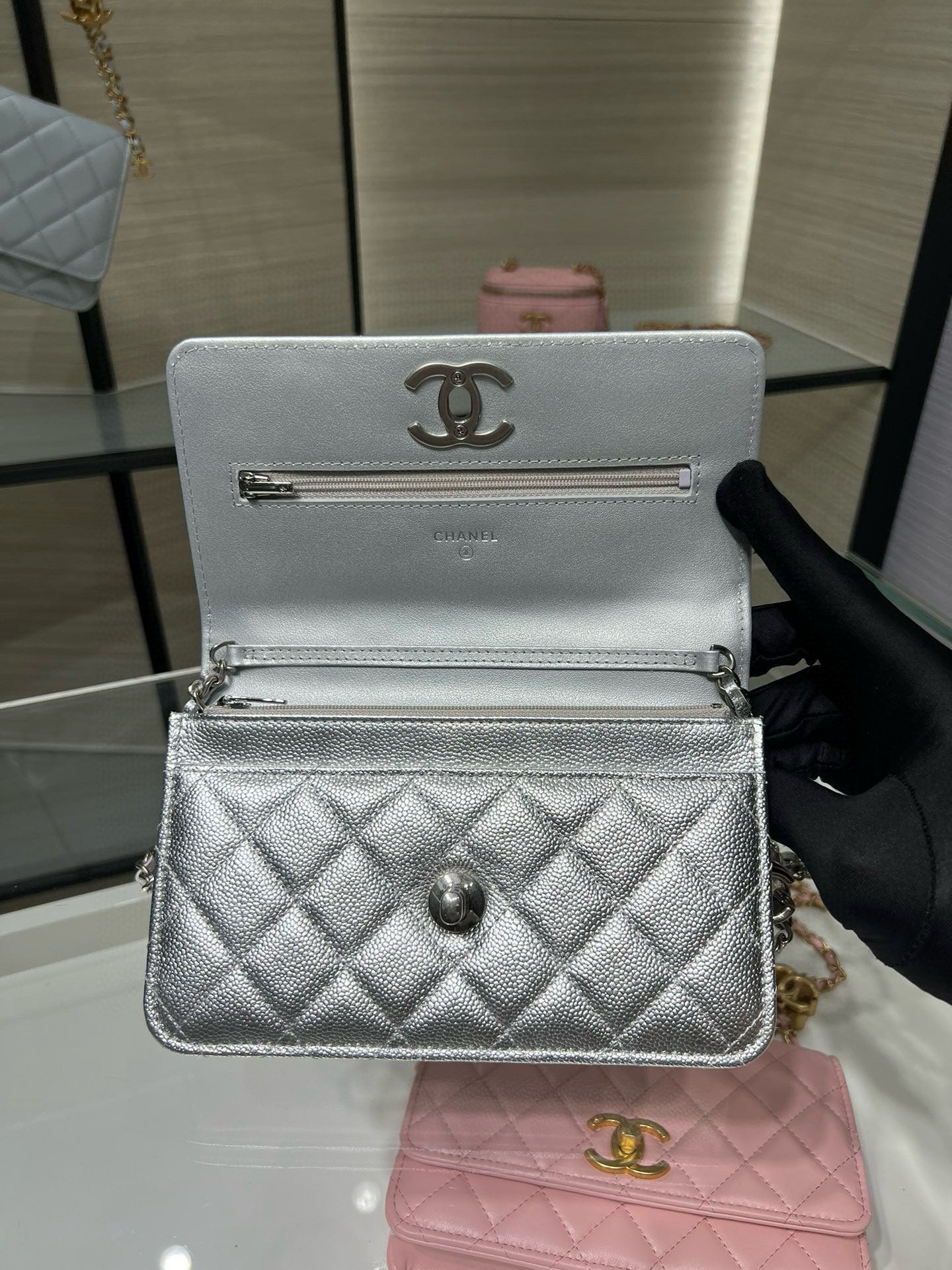 Silver Chanel small flap bag with metal logo and top handle clasp