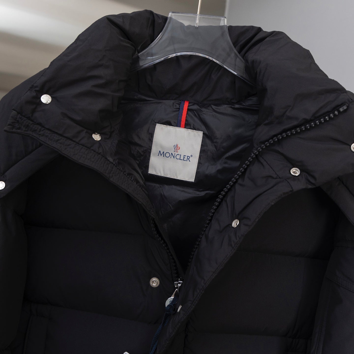 Moncler long puffer jacket lining view with hood and MONCLER patch