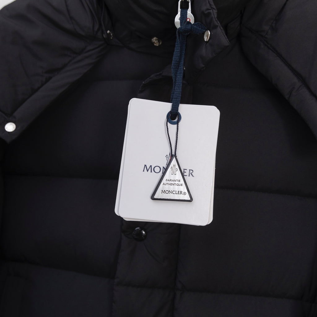 Moncler long puffer jacket with hanging size tag on front snap panel