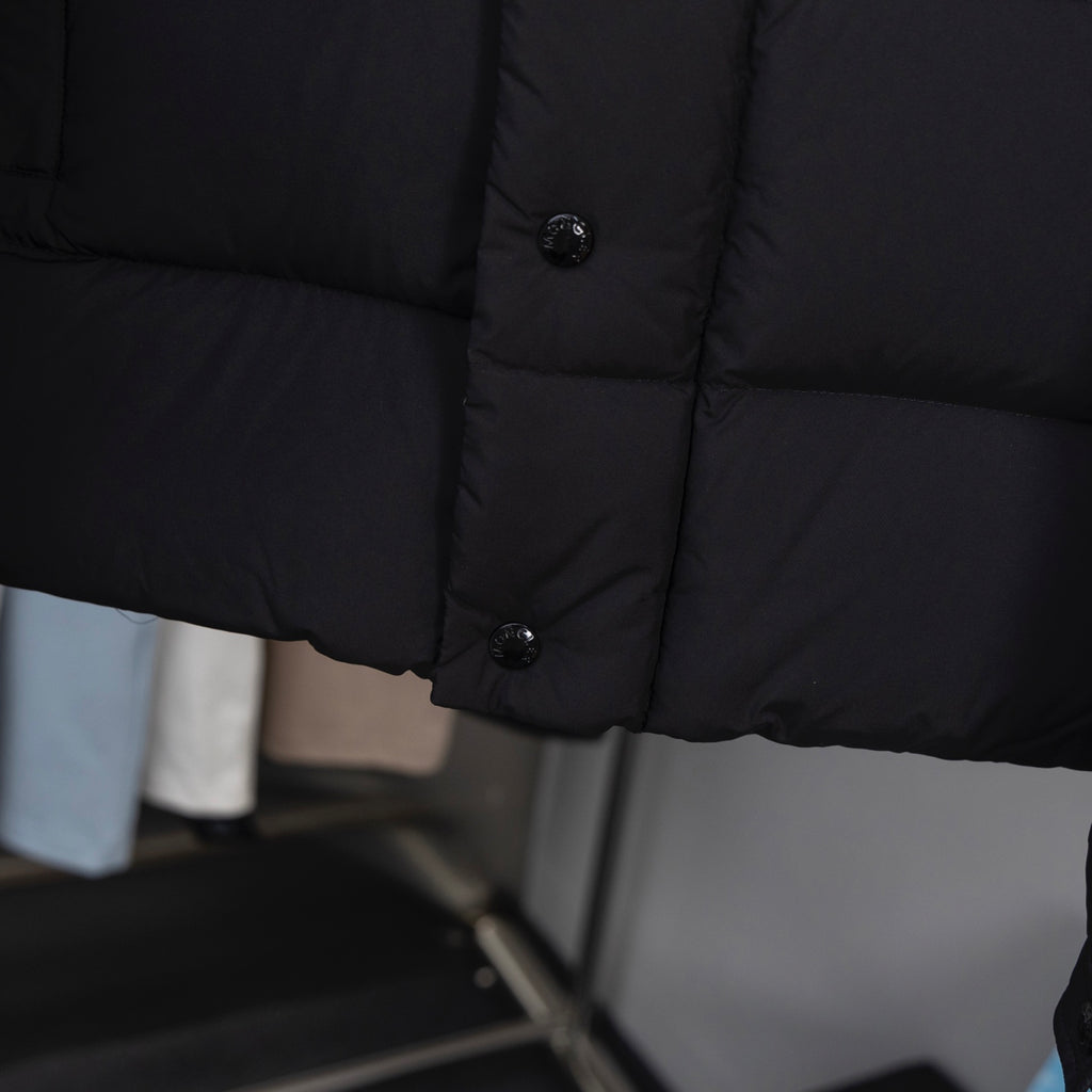 Long puffer jacket sleeve with button placket and quilted panels