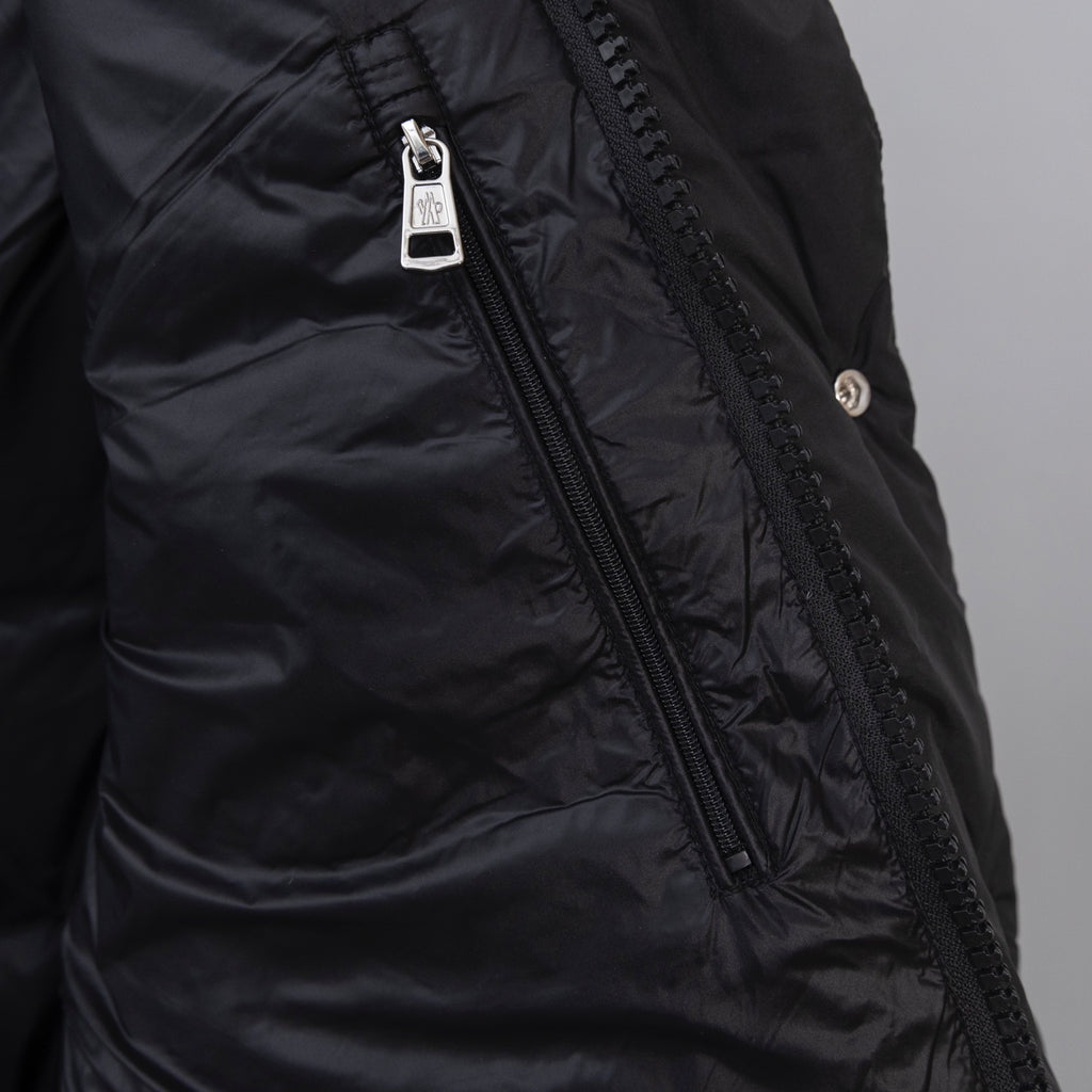 Moncler long puffer jacket front zipper with branded pull and stitched panels