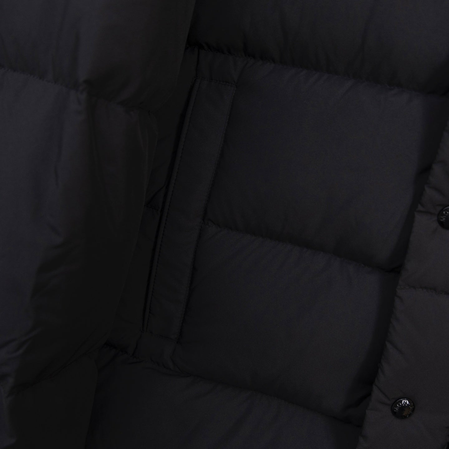 Long puffer jacket front with zipper and horizontal quilted sections