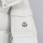 White puffer jacket front flap pocket with circular logo patch