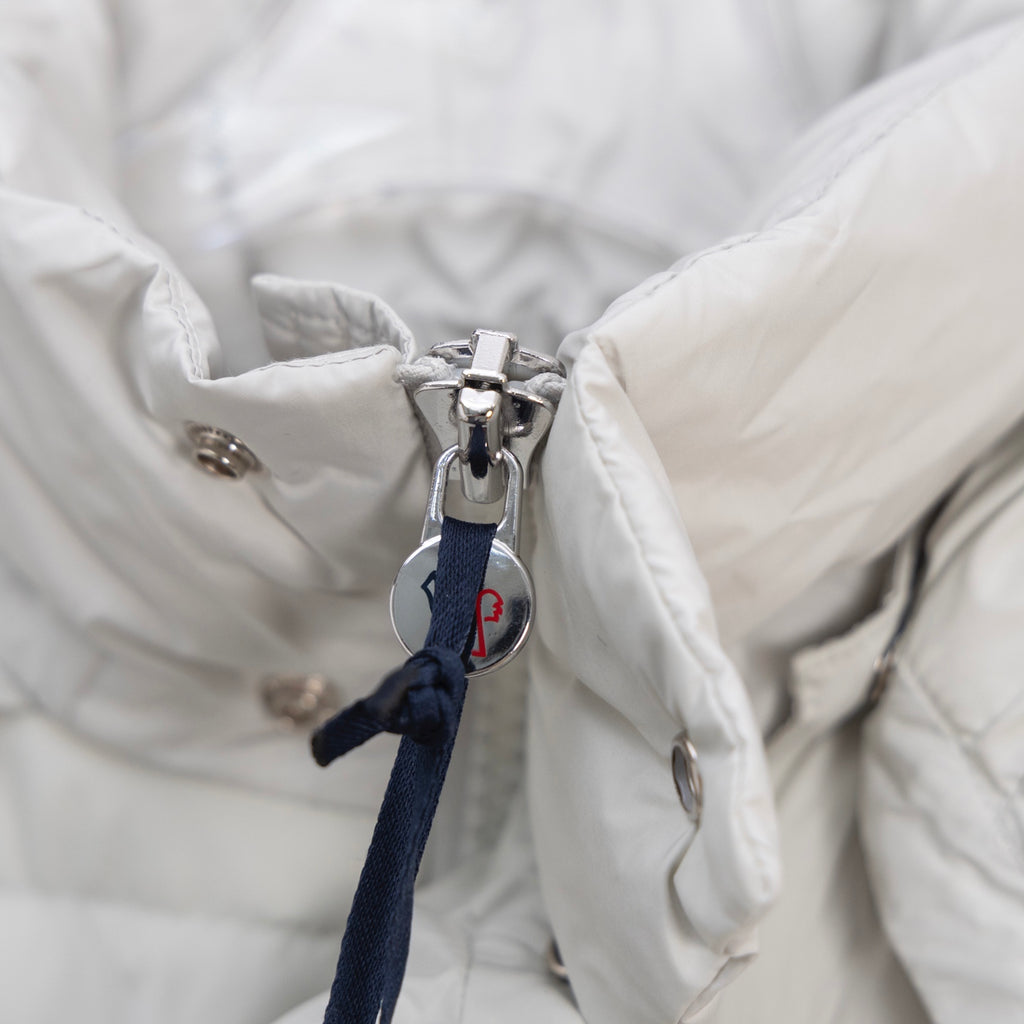 White puffer jacket with metal zipper and fabric pull tab