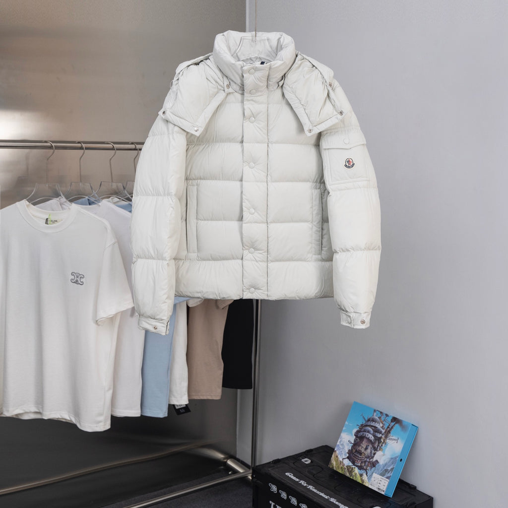 White hooded puffer jacket with snap pockets and quilted insulation panels