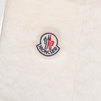 Moncler round logo patch on cream padded vest fabric