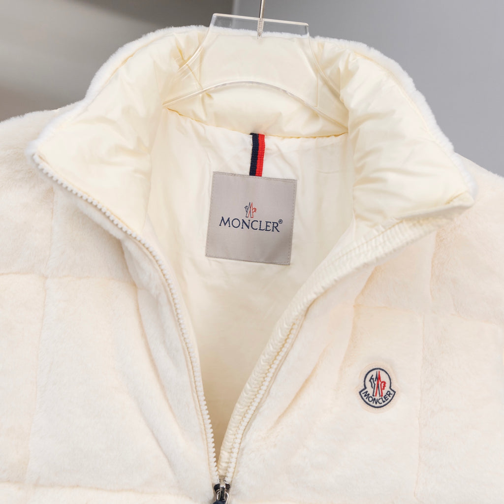 Moncler cream padded vest with striped trim at the neck and zip placket