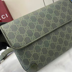 Gucci GG monogram canvas bag corner, green textured trim and stitching detail.