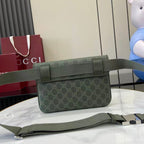 Green Gucci GG monogram bag with flap and adjustable web strap, front view.