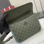 Gucci bag interior view: khaki lining and green exterior with snap details.