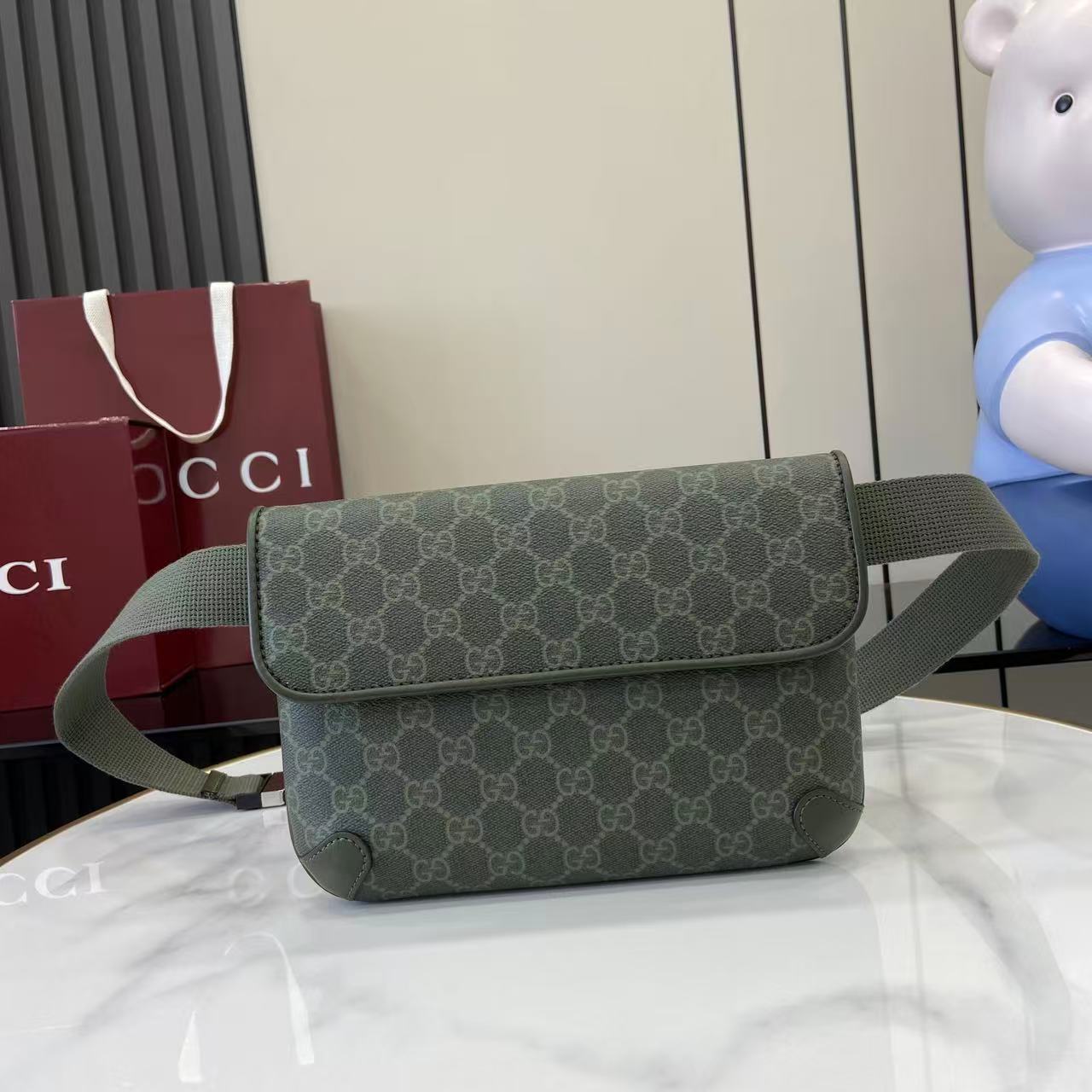 Gucci bag with flap and GG monogram canvas, green crossbody shoulder strap.