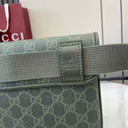 Gucci web strap attachment with leather logo patch, green and gray hardware.