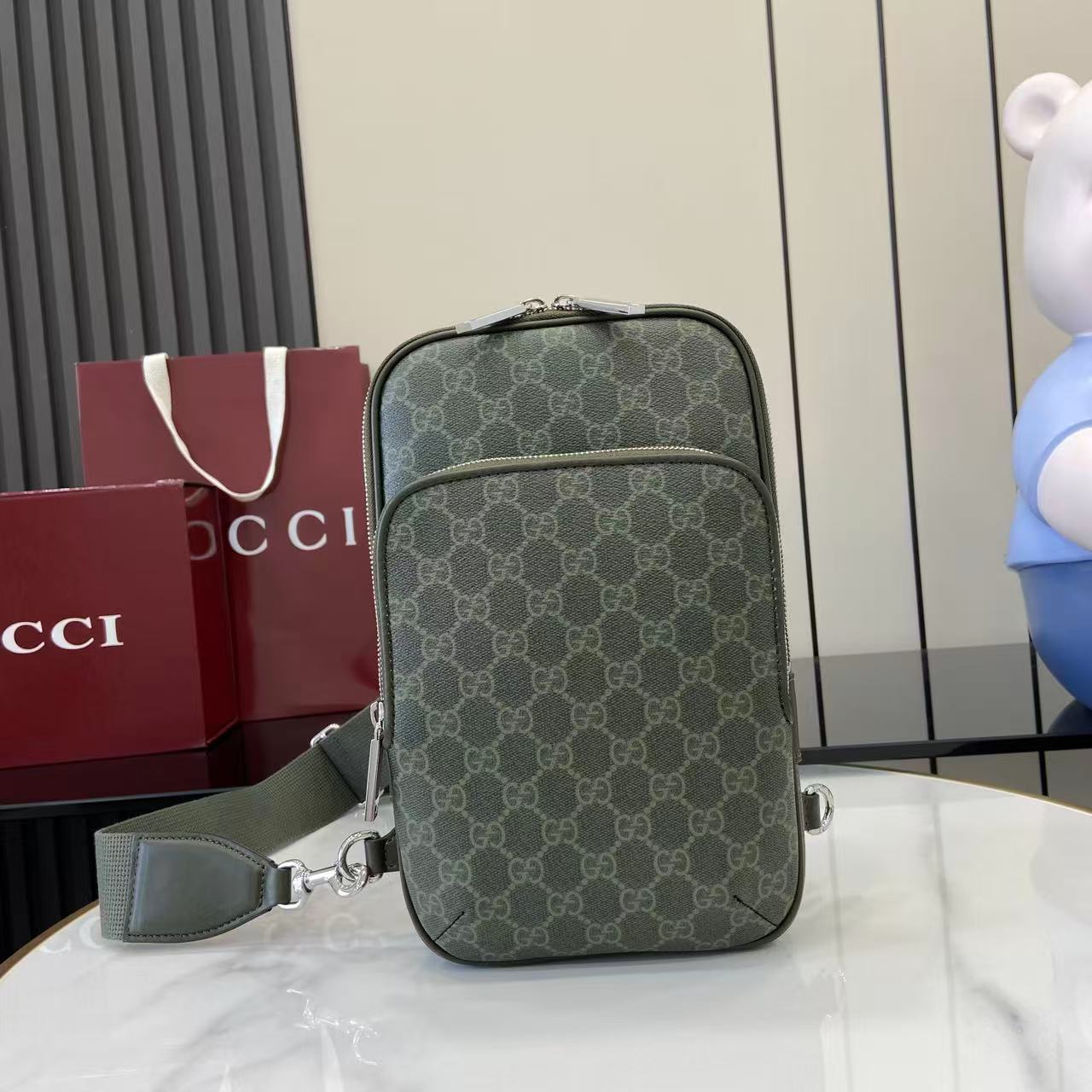 Gucci bag in dark green monogram canvas with top zip and detachable strap