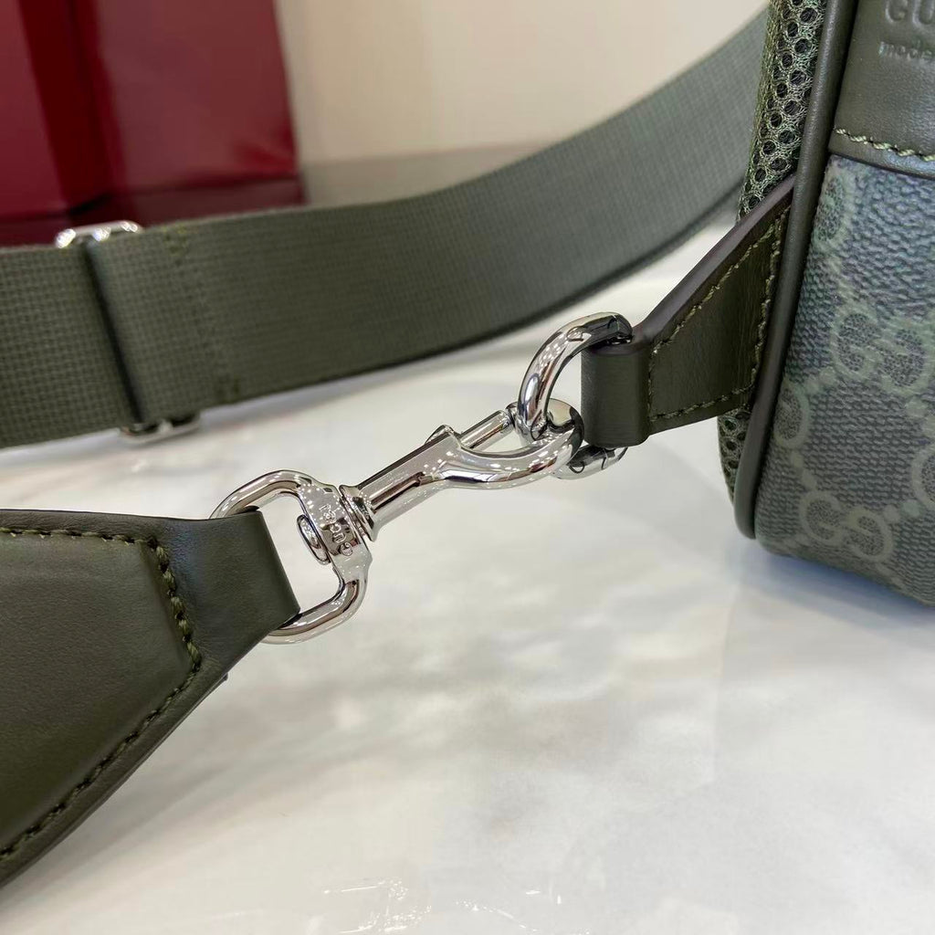 Gucci bag crossbody strap with dark green webbing and metal lobster clasps