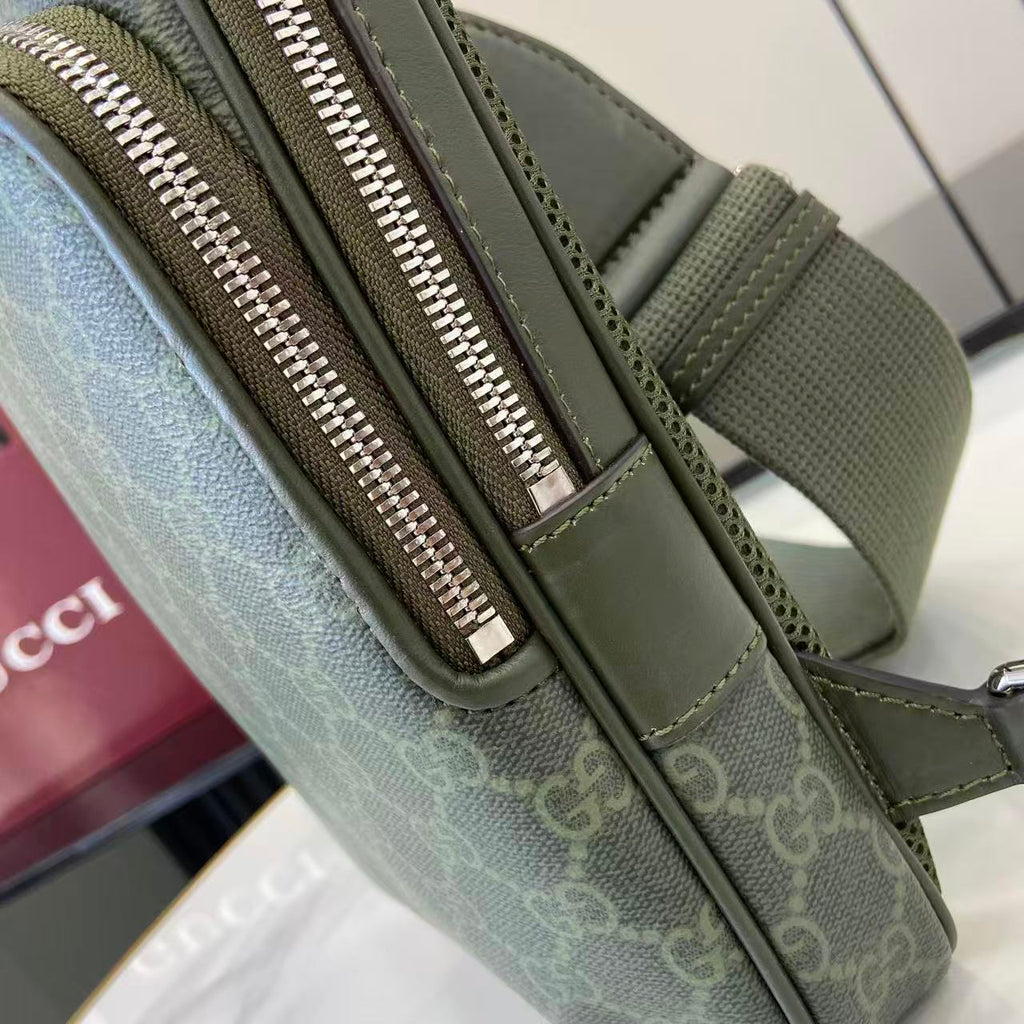 Gucci bag with green zip pull and leather trim, close-up of front zipper