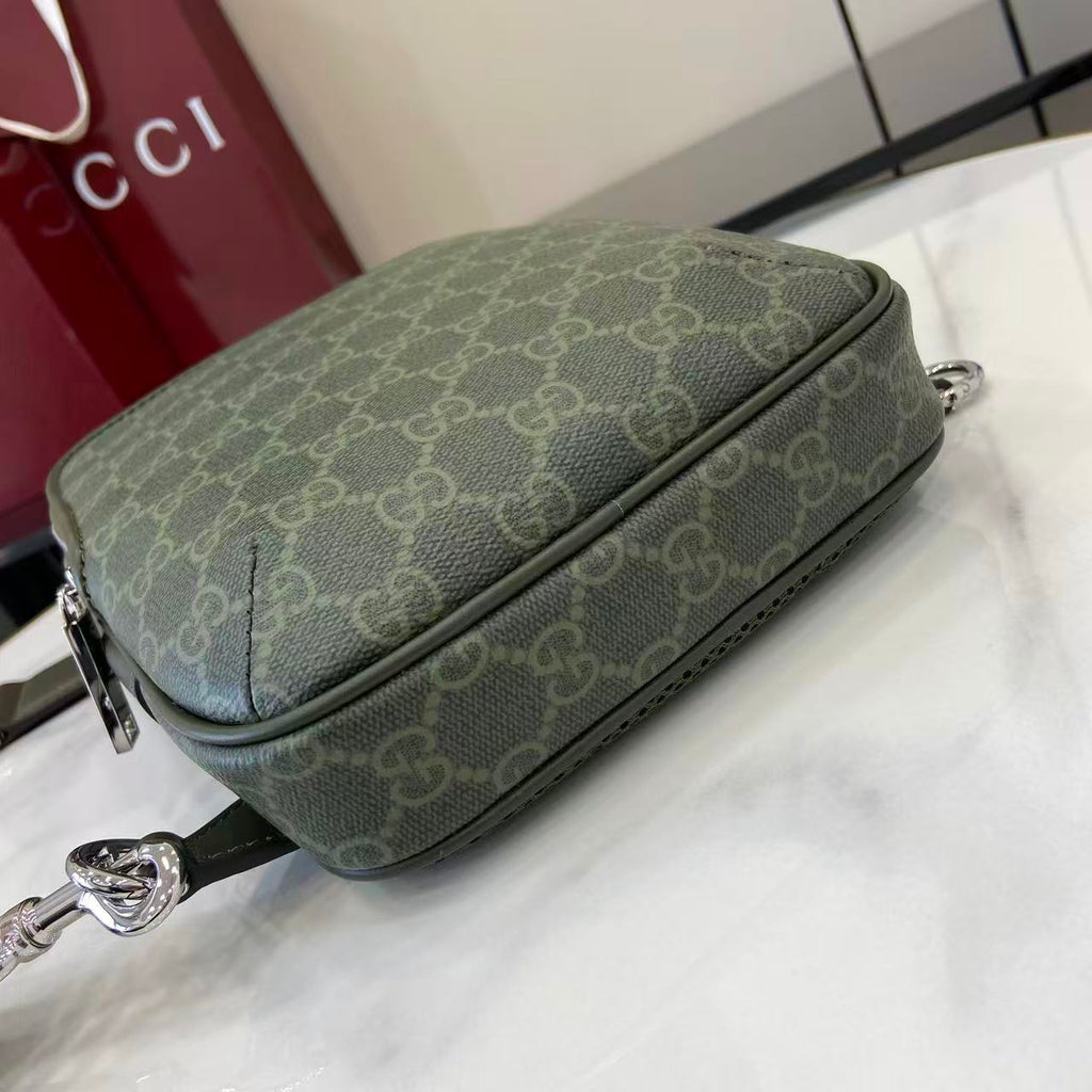 Gucci bag dark green monogram canvas with horizontal zip and silver chain pull