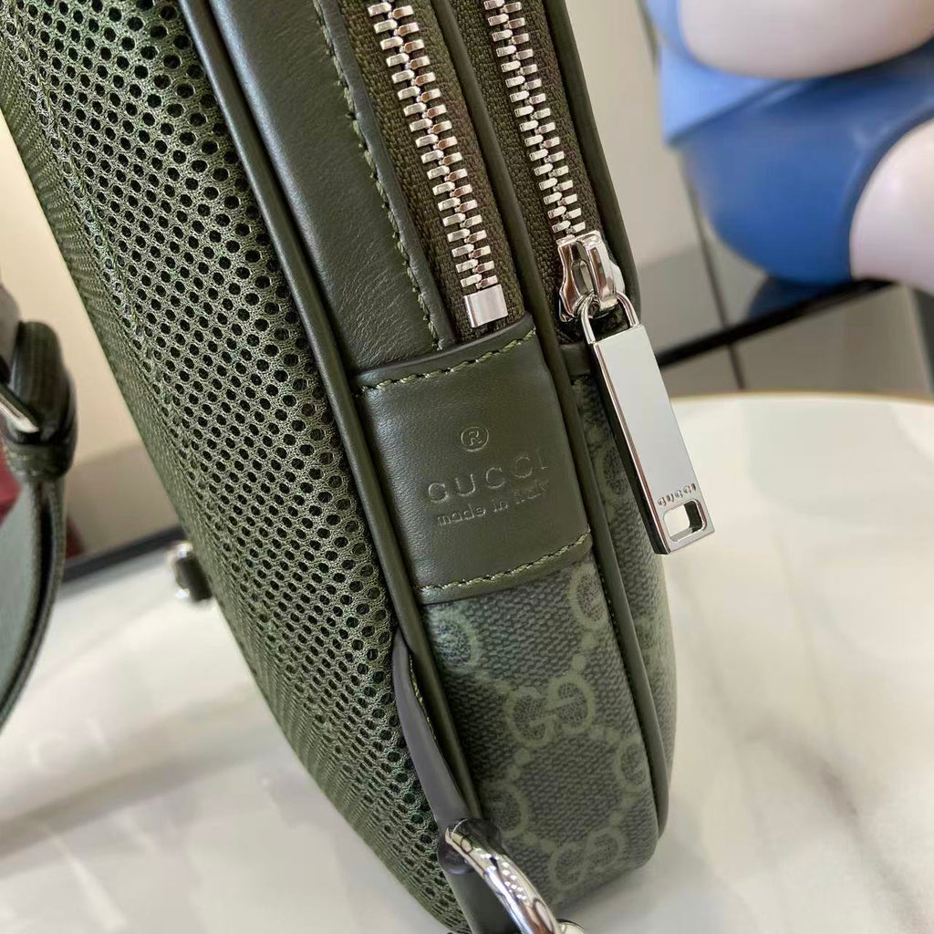 Gucci bag side view with mesh panel, dark green leather trim, and silver hardware