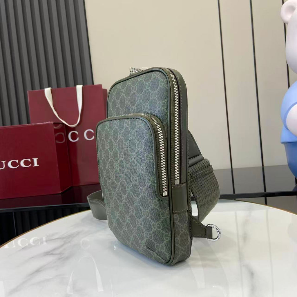 Gucci crossbody bag in dark green monogram canvas with zip closure and strap
