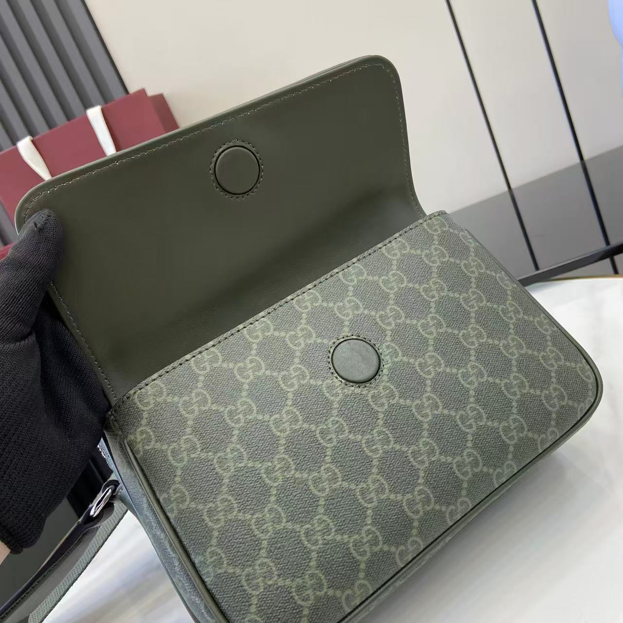 Monogram crossbody bag flap in dark green with GG pattern and snap buttons