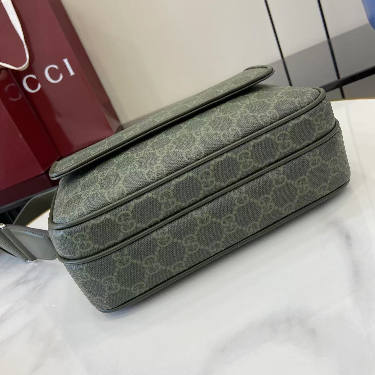 Monogram crossbody bag in dark green with GG pattern and wide top handle strap