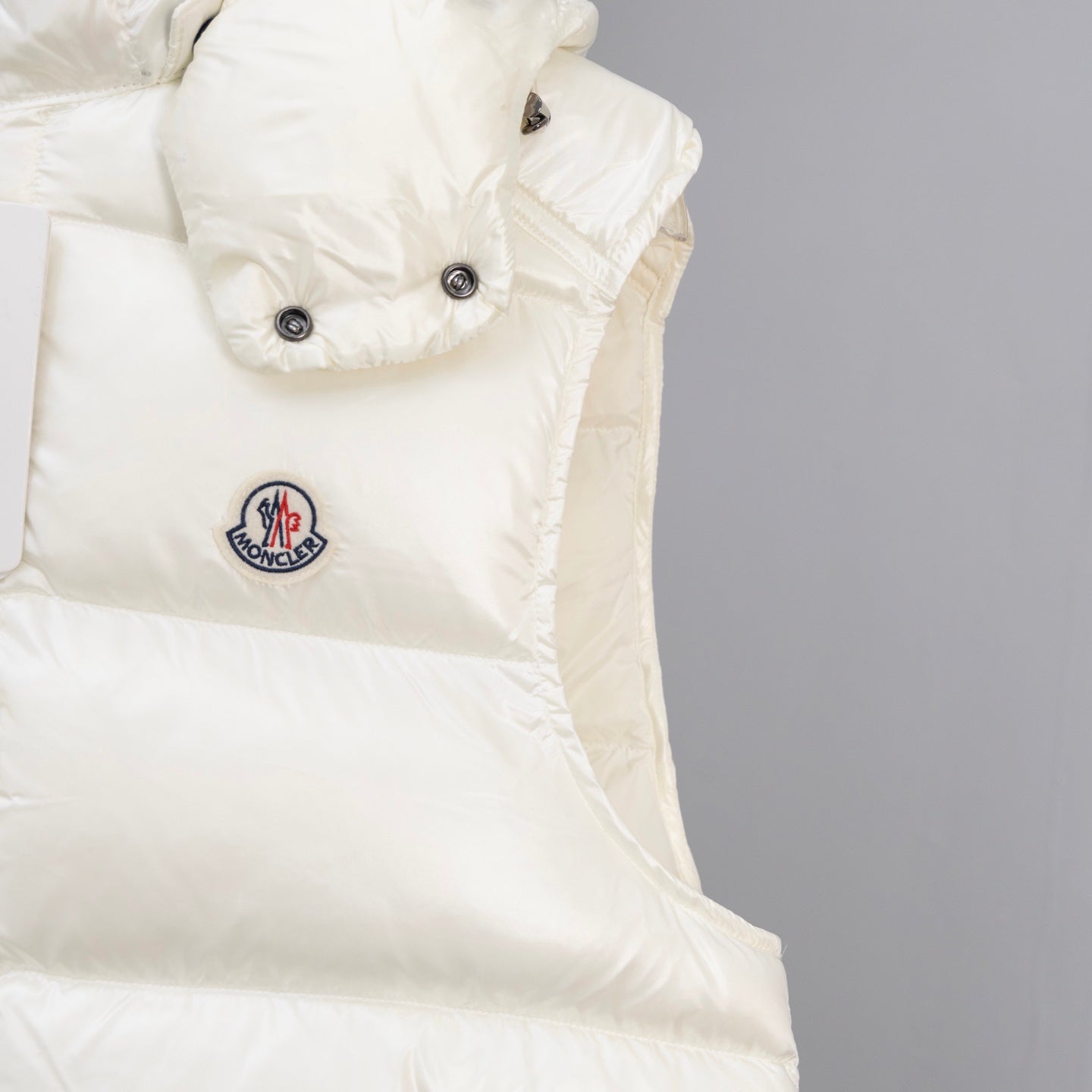 White padded jacket with Moncler logo patch and snap button placket