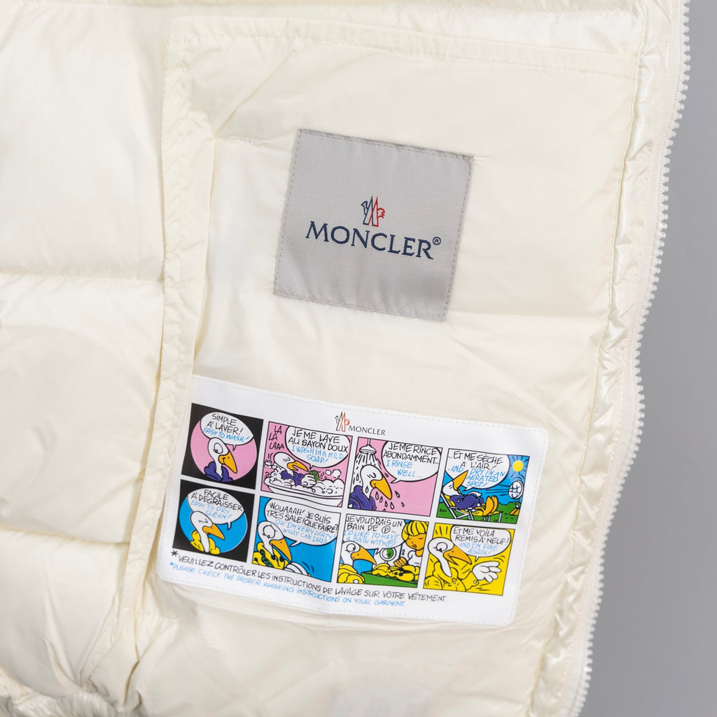 White jacket pocket with printed Moncler label and zipper