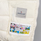 White jacket pocket with printed Moncler label and zipper