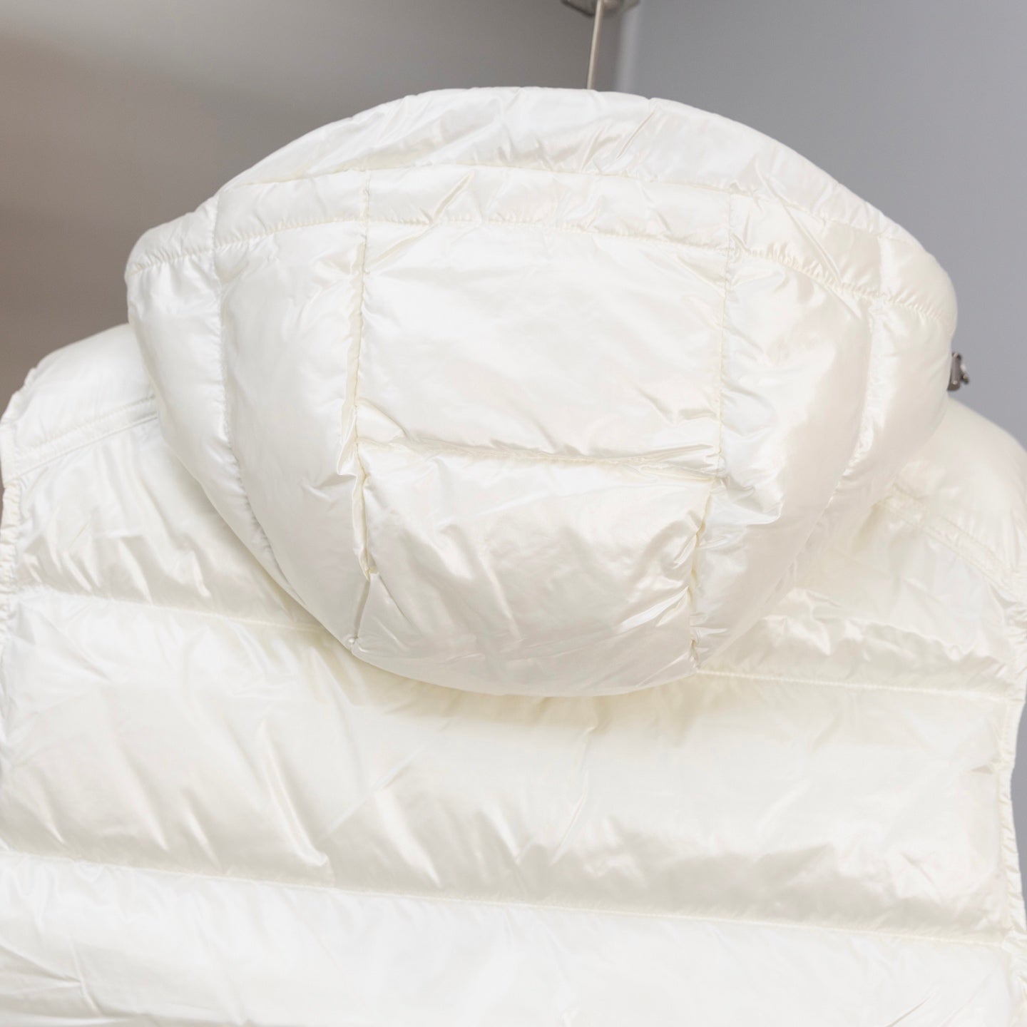 White hooded padded jacket with quilted back panel