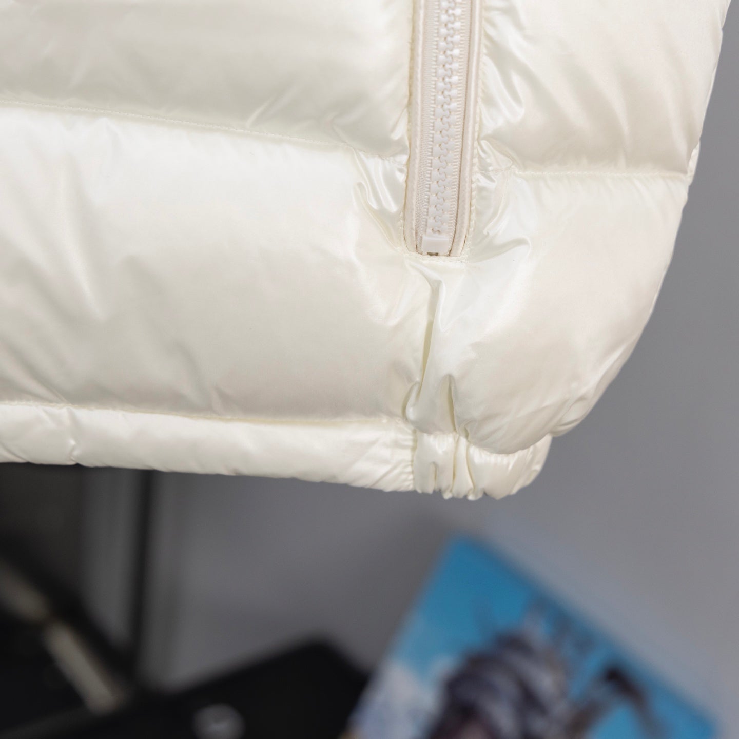 Long padded jacket, off-white quilted lower panel and hem