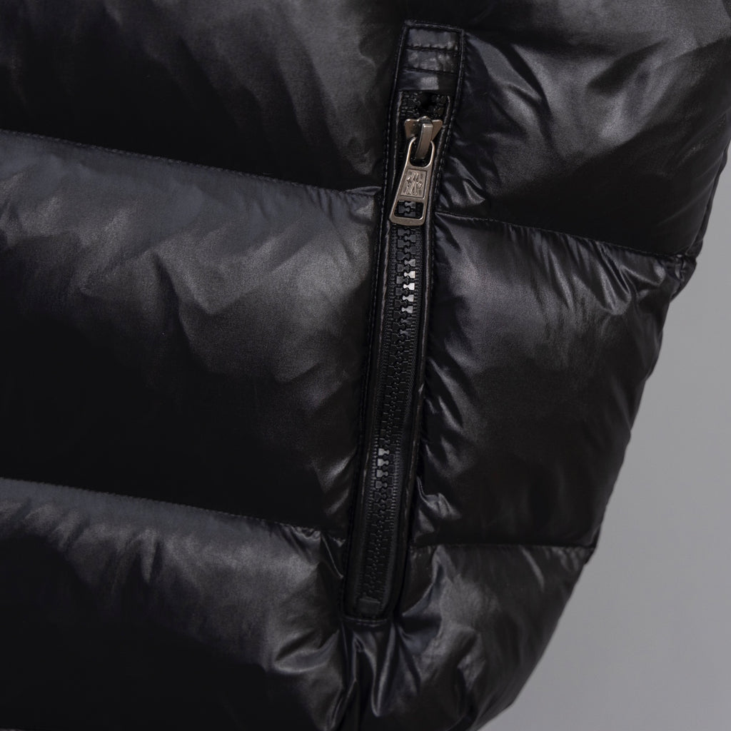 Moncler long puffer jacket, front zipper detail on dark outerwear