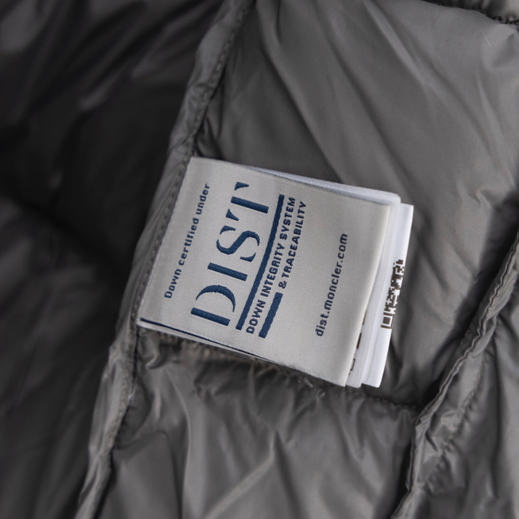 Long puffer vest inner label tag on gray lining