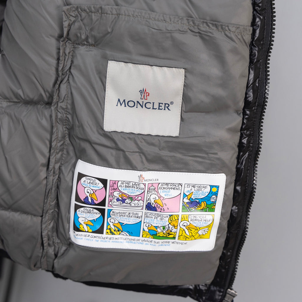 Long puffer vest interior with brand patch and colorful graphic pocket lining