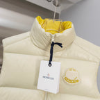 Cream padded vest with stand collar, zip front, hanging tag and logo patch