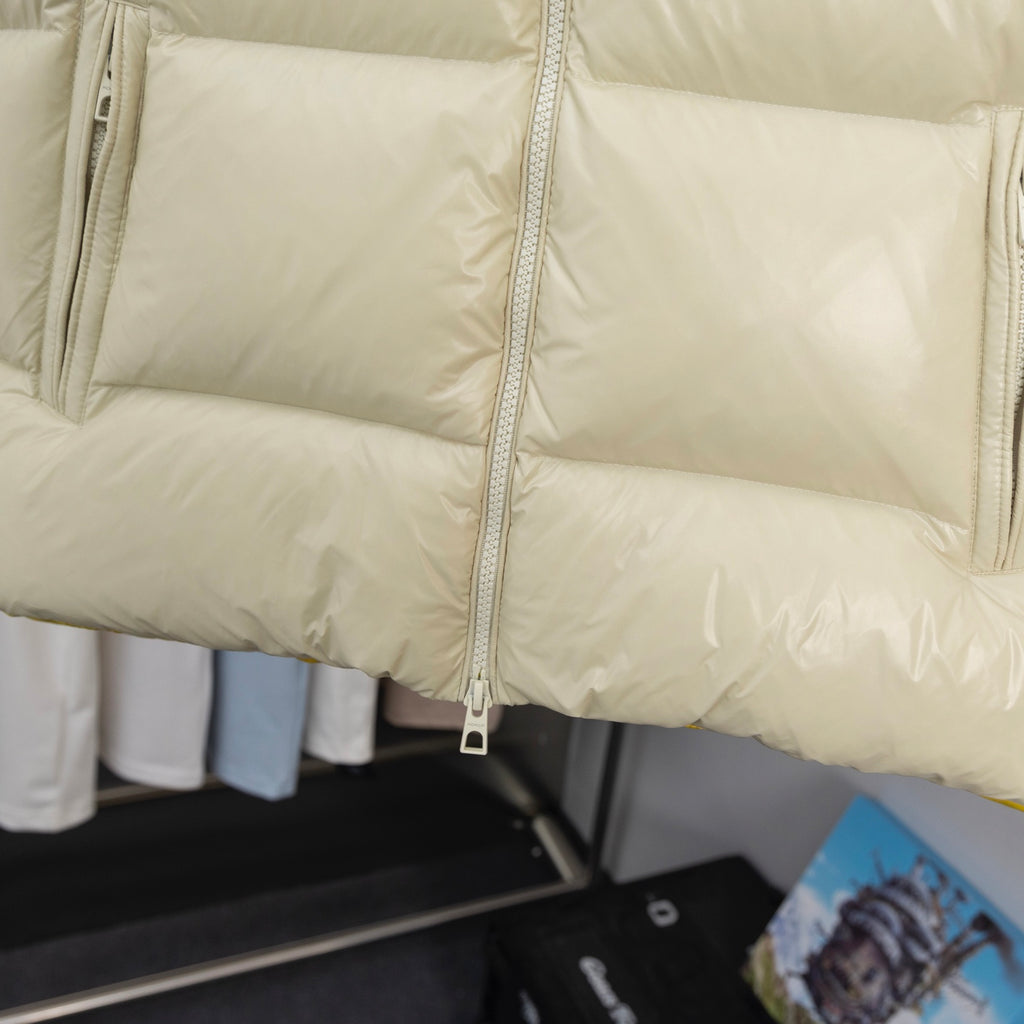 Long puffer coat with front zipper and quilted padding, cream fabric