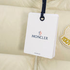 Cream padded vest with hanging care tag and embroidered logo patch edge